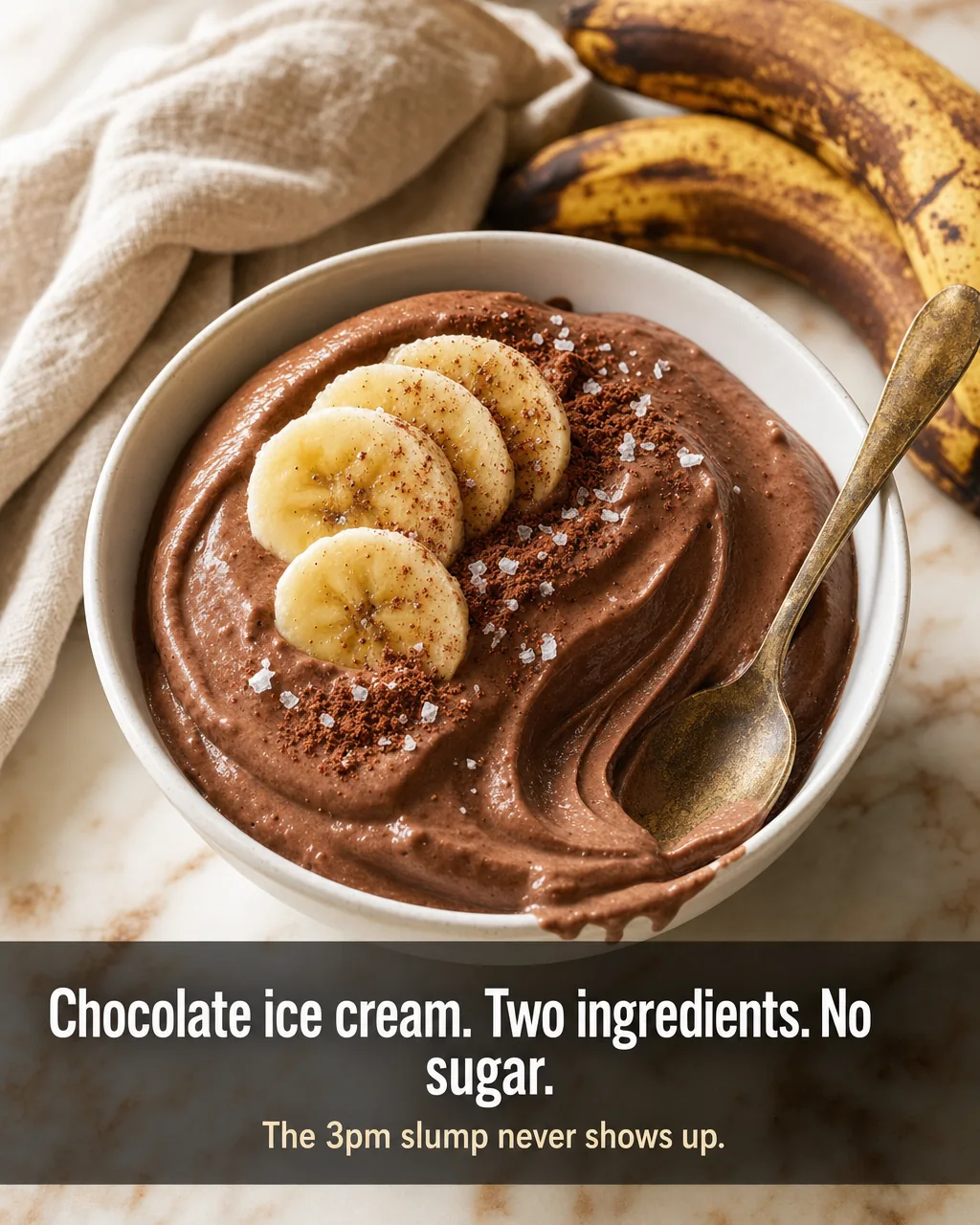Bowl of thick chocolate banana nice cream topped with banana coins, no added sugar
